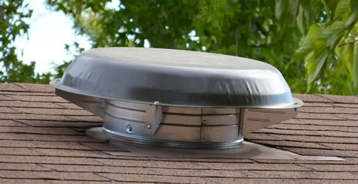 attic fan installation services with low-profile roof ventilation unit in Tampa, FL