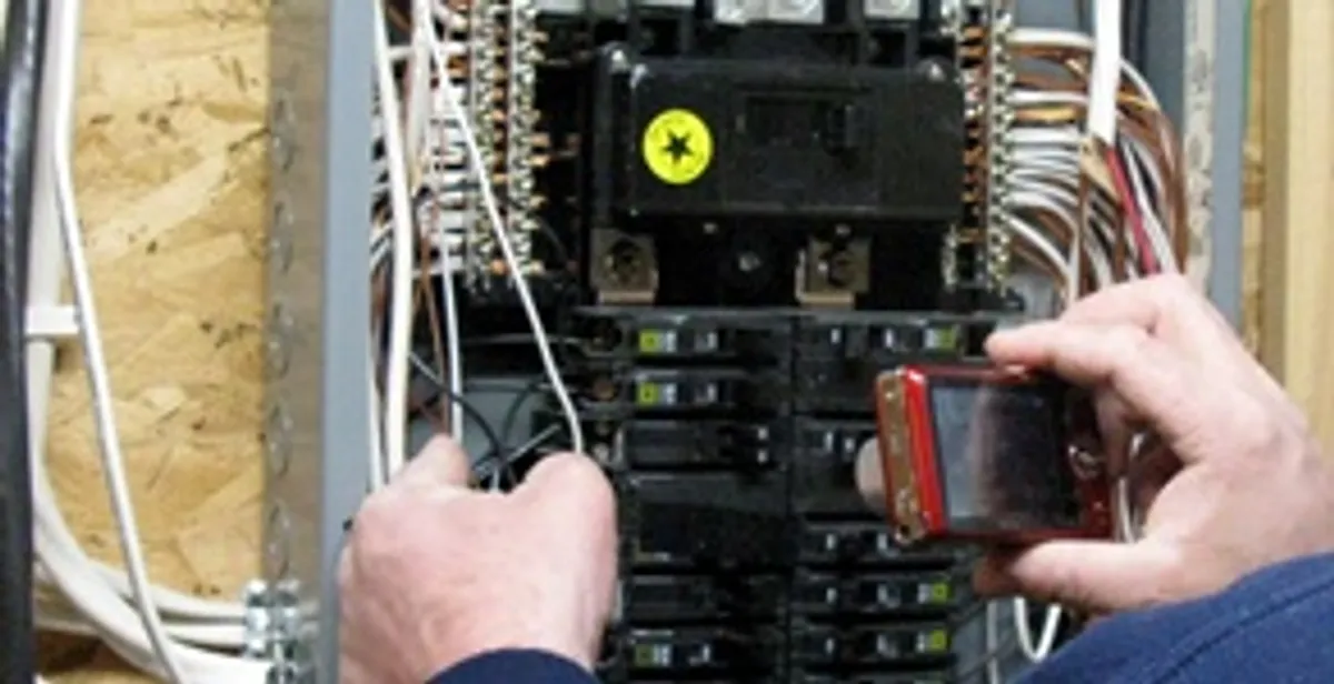 Home electrical inspection of circuit breaker panel by licensed electrician in Tampa, FL
