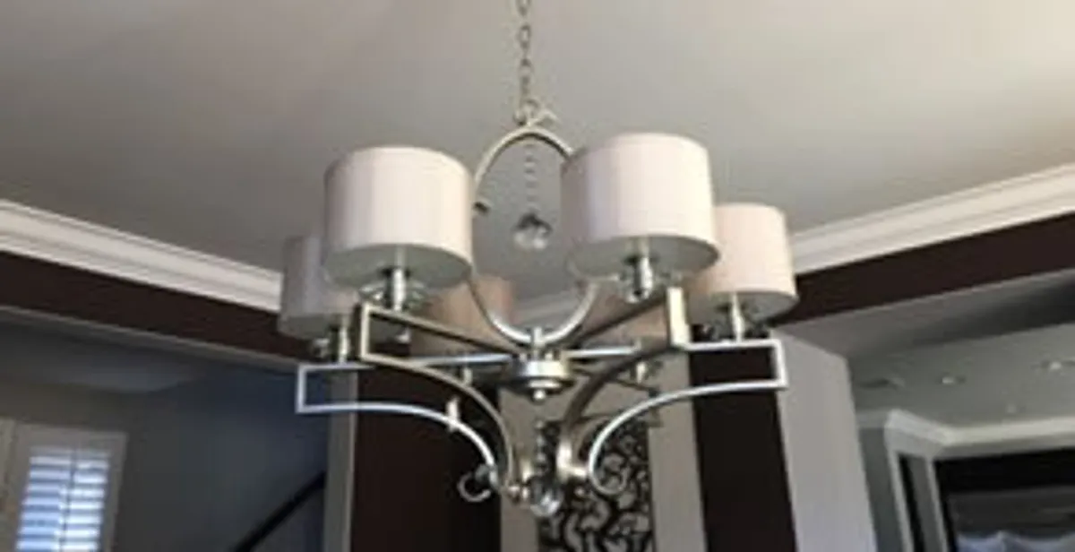 Modern chandelier installation with multiple light fixtures in Tampa, FL