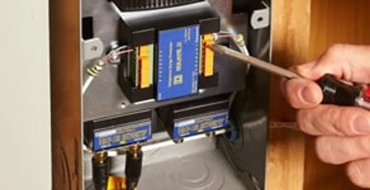 Whole home surge protection device being installed by a licensed electrician to protect electrical systems in Tampa, FL